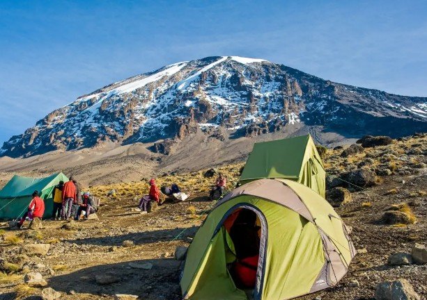 Professional Kilimanjaro guides briefing climbers before ascent