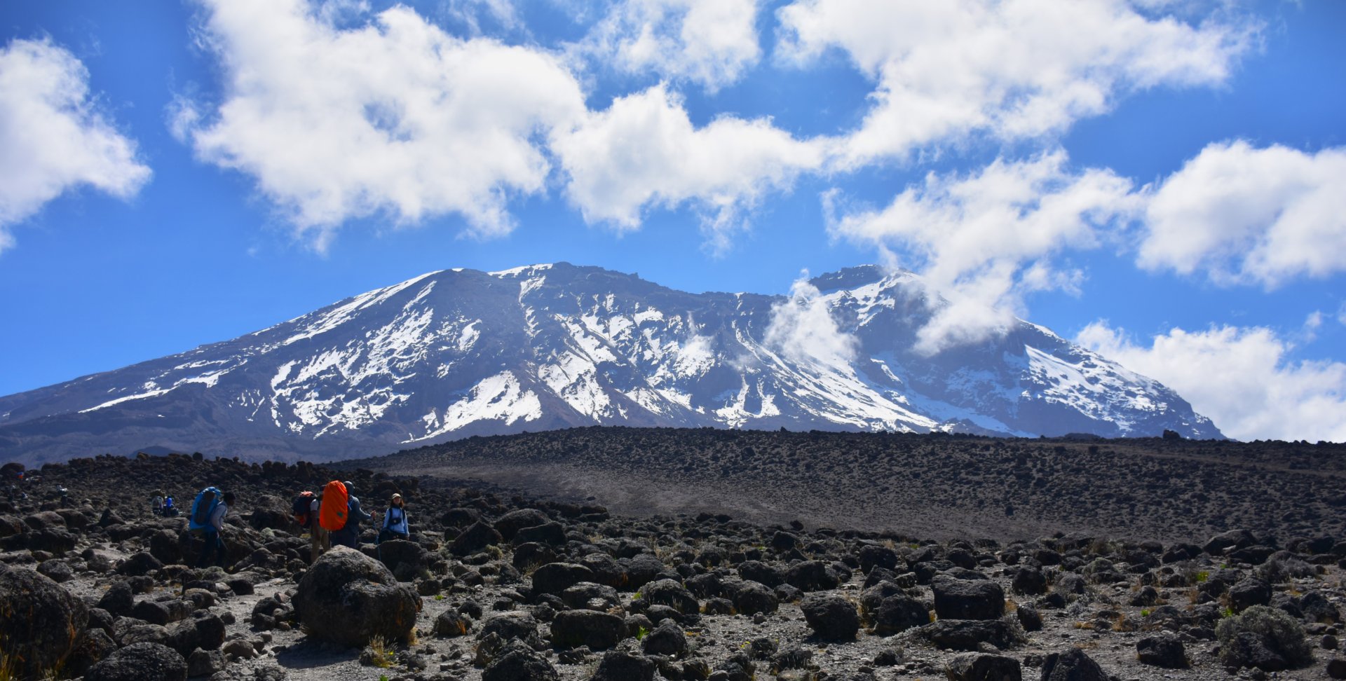 Mount Kilimanjaro and Mount Meru rising above the Tanzanian landscape at sunrise