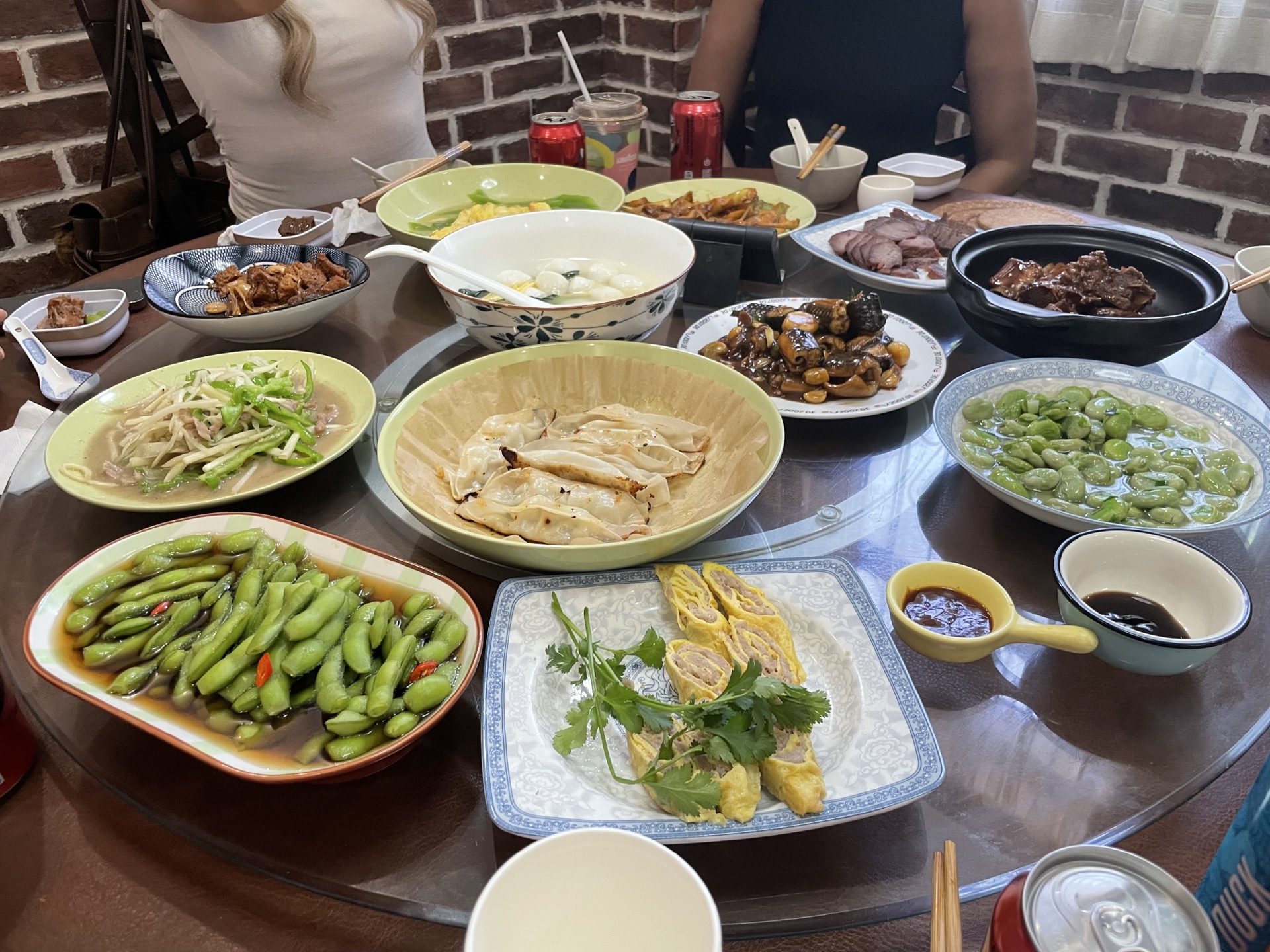 A home-cooked Chinese dinner spread on a local family's table in Shanghai