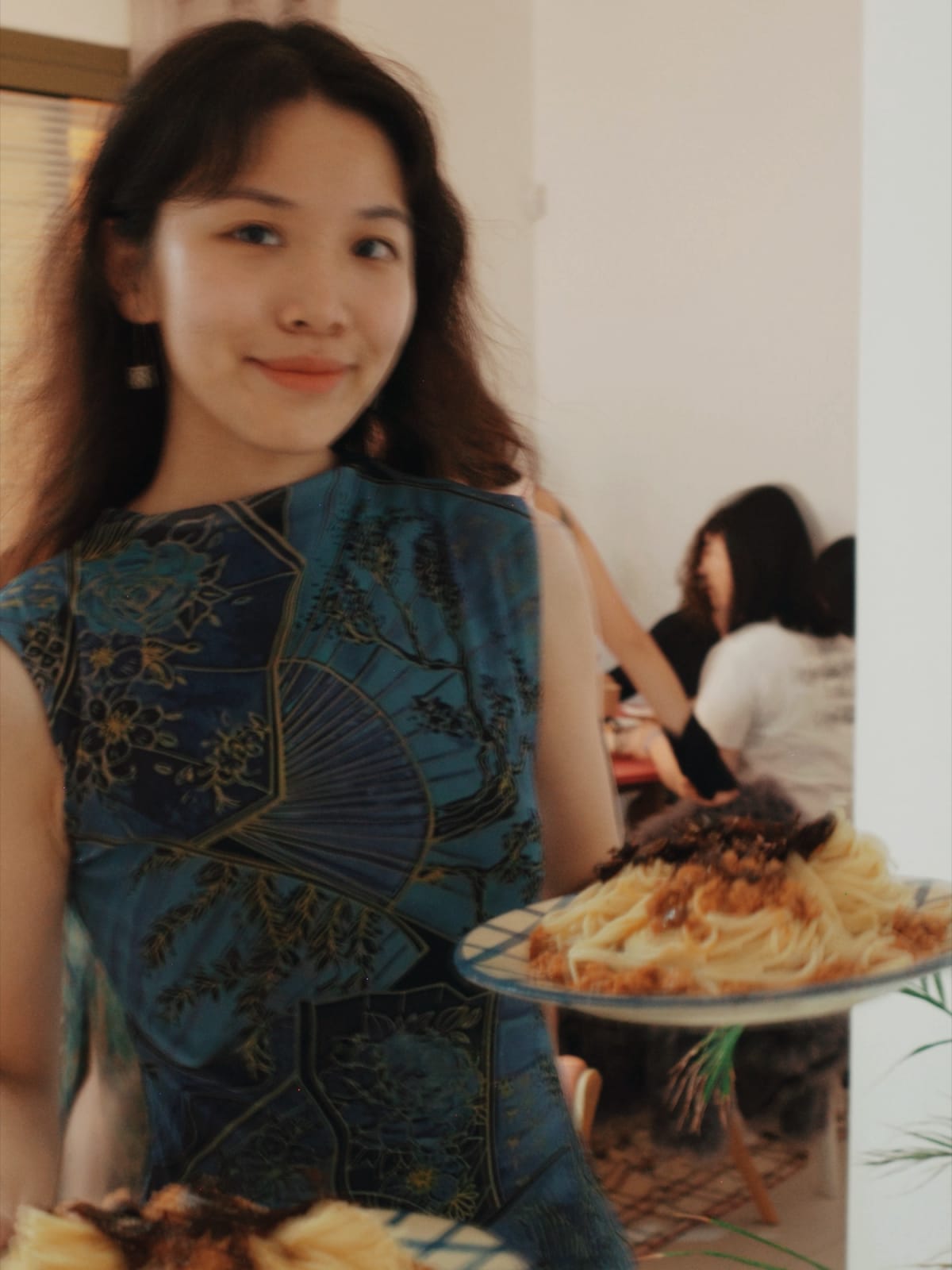 Ming and her guests at a home dinner