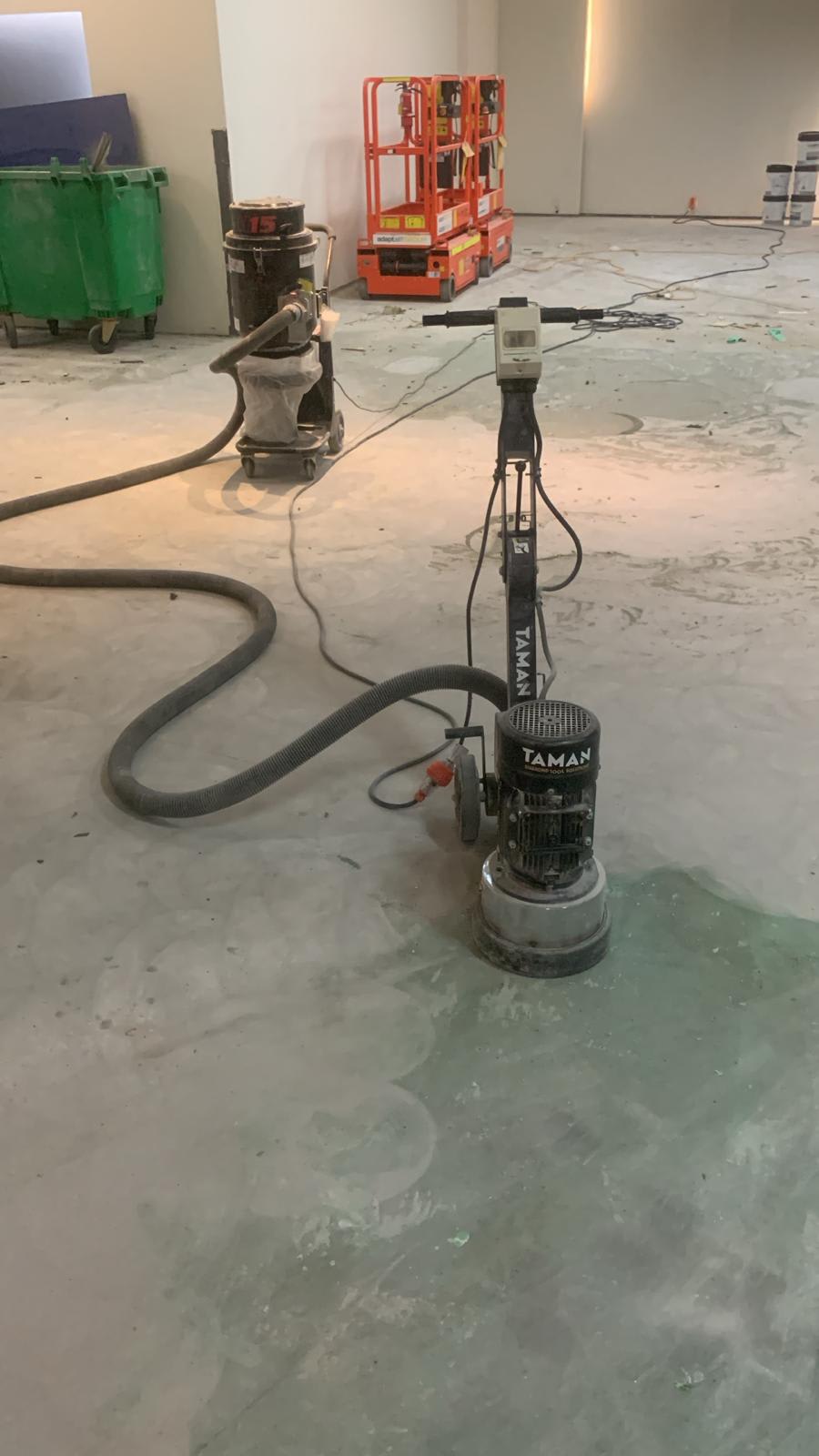 Concrete grinding machine in action