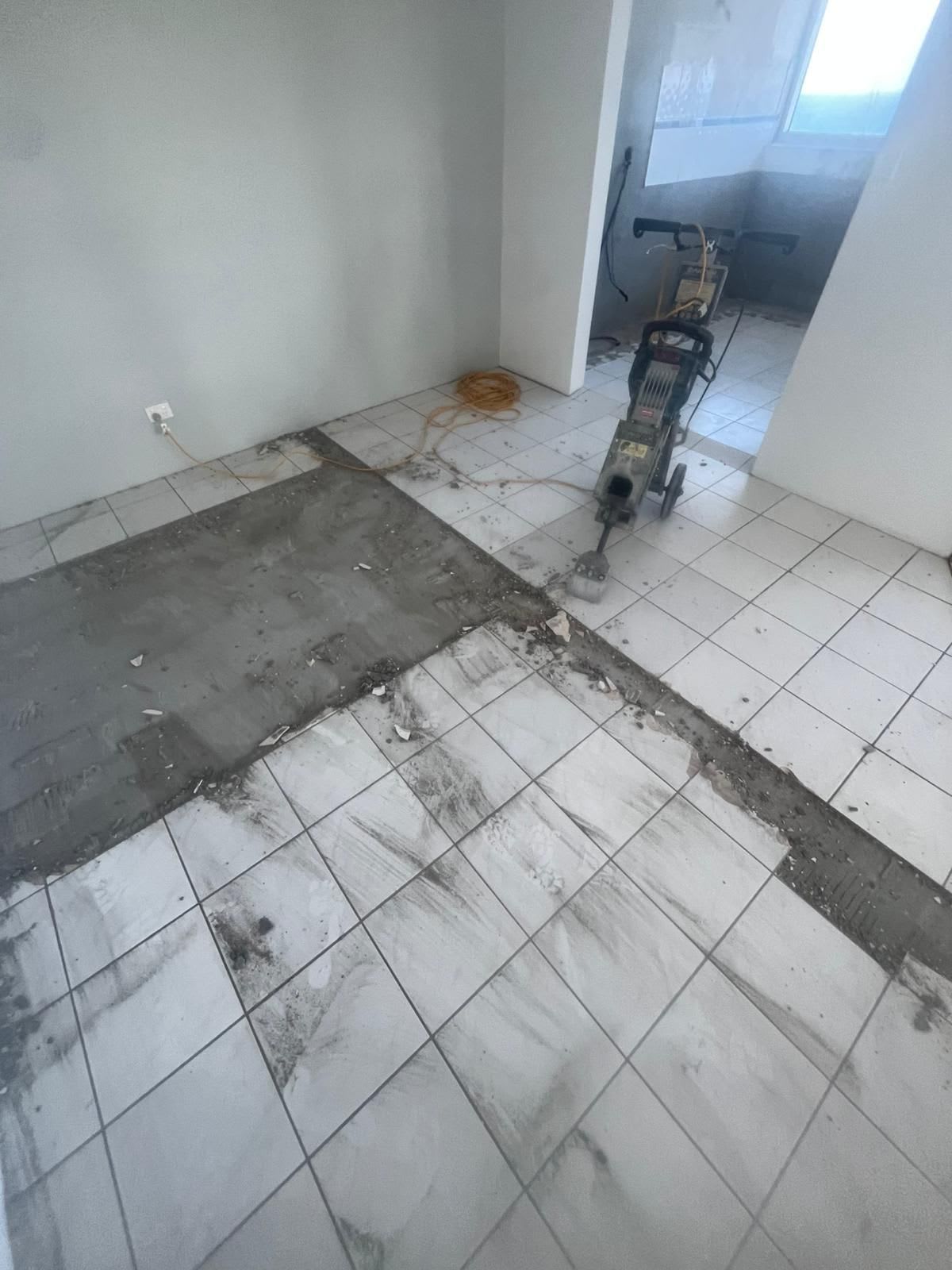 Tile Removal In Progress With Machine