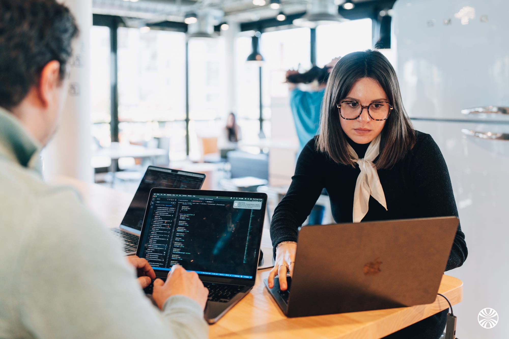 Finthesis team members working together in a coworking space