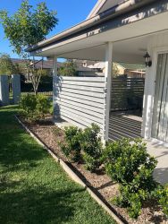 exterior shot of a planters and a relaxing outdoor seating area.
