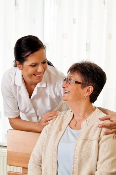 Elderly woman and nurse