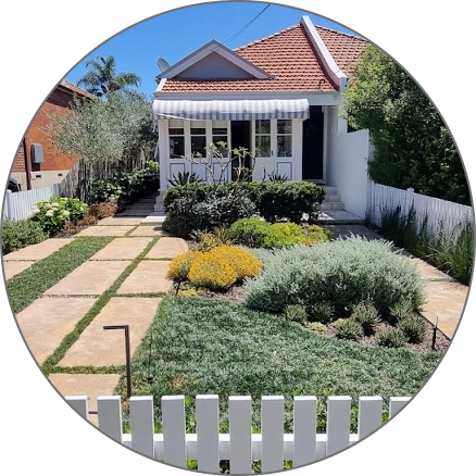 a white house with a white picket fence