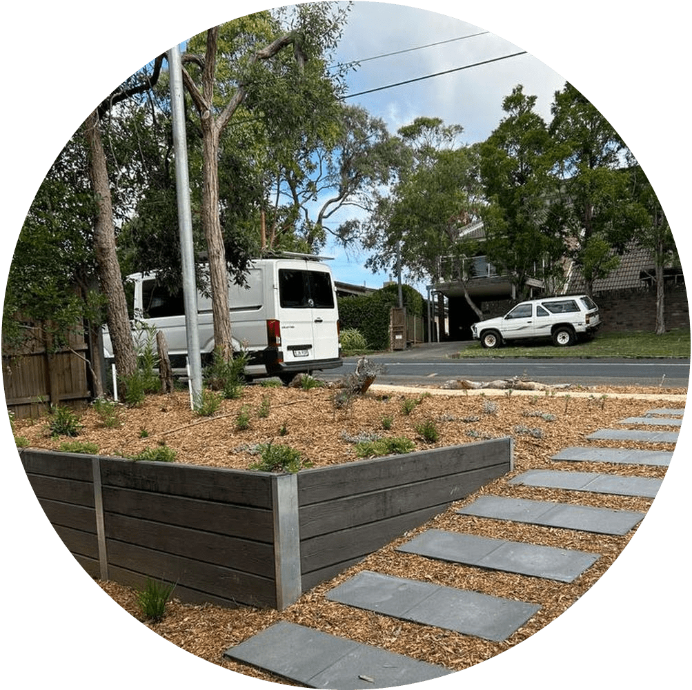 a white van parked next to a wooden planter
