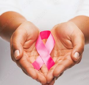 Breast Cancer ribbon in open hands