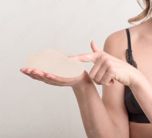 woman holding silicone breast