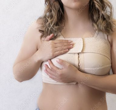 Woman holding chest compression wraps