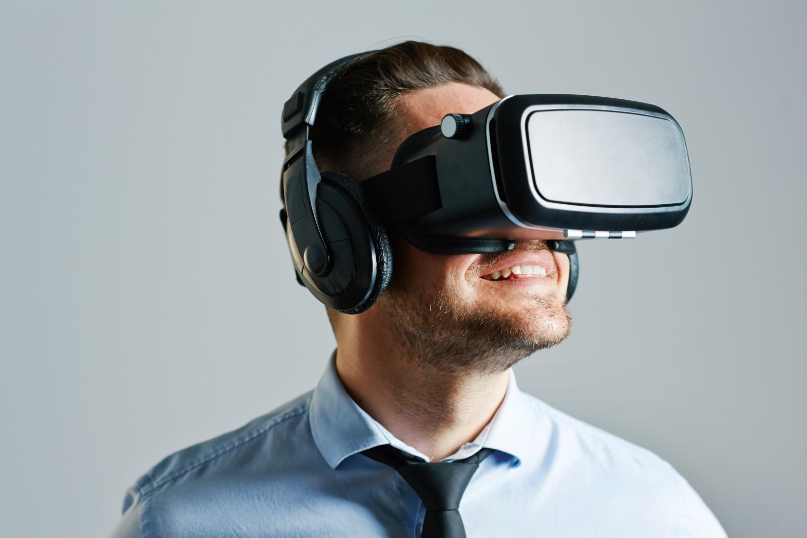 Man with VR headset and headphones on