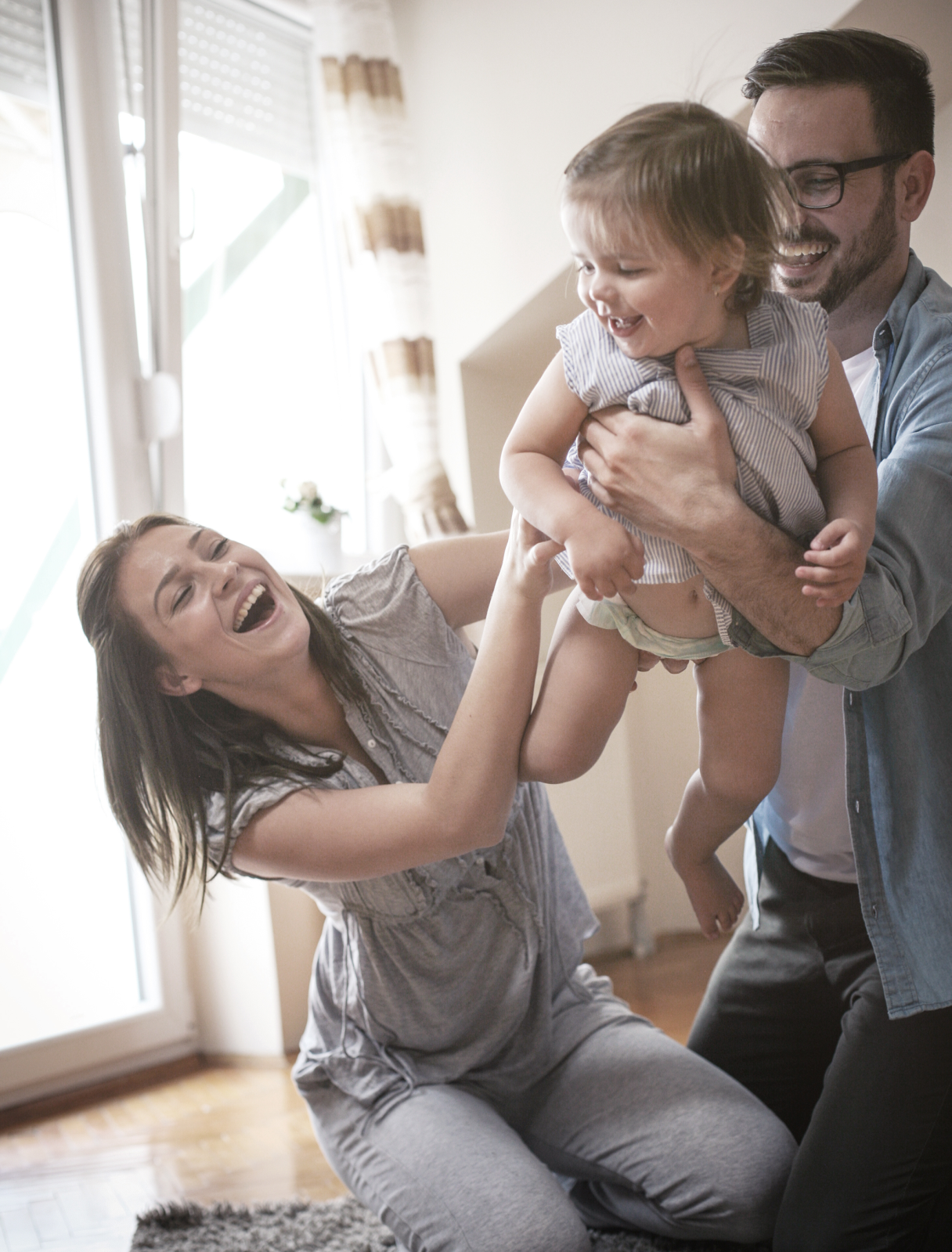 Parents playing with toddler