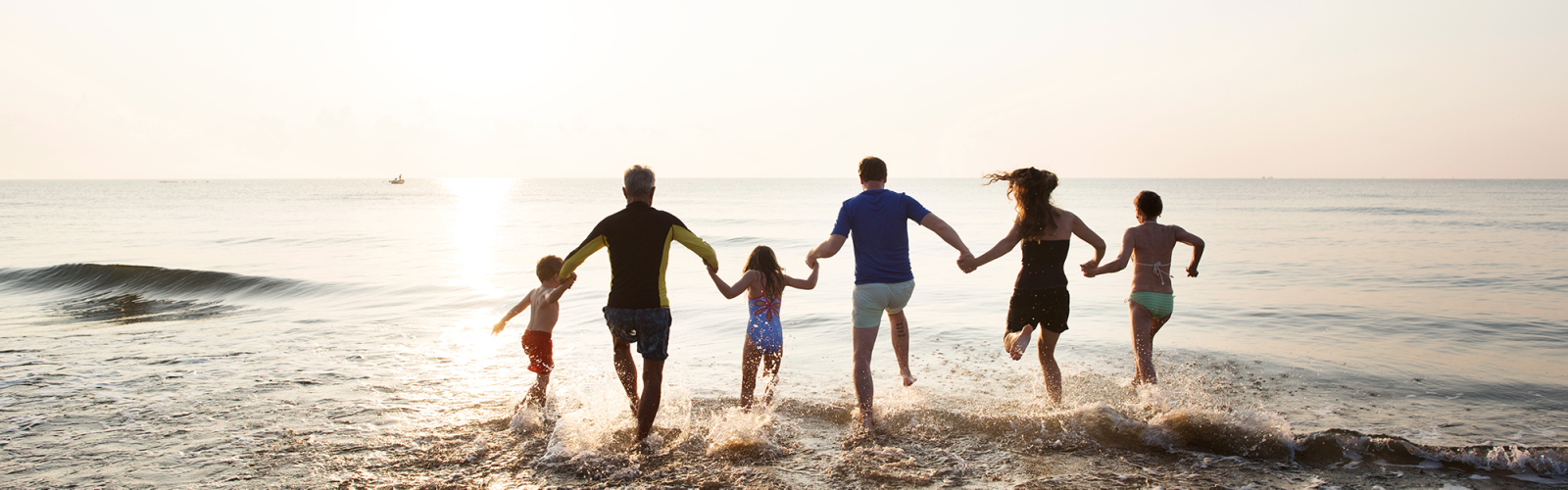 Stock image of family at beach in water