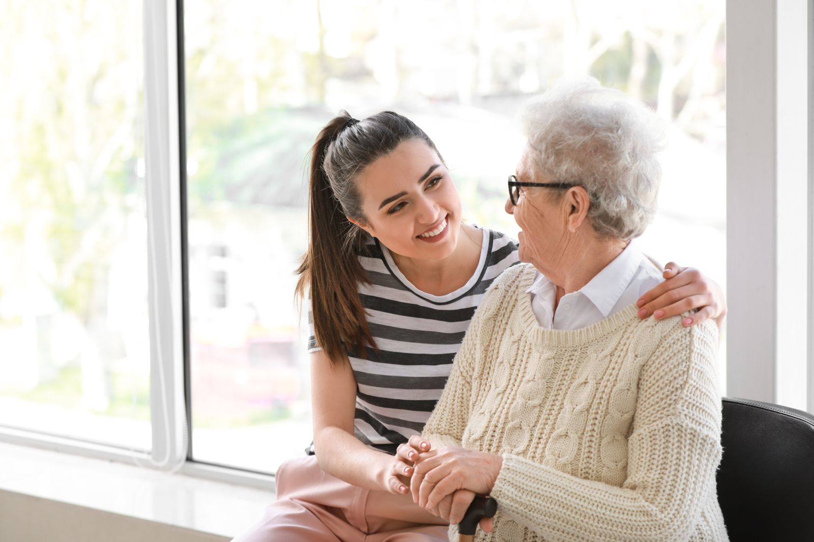 A young woman interacting with an older woman