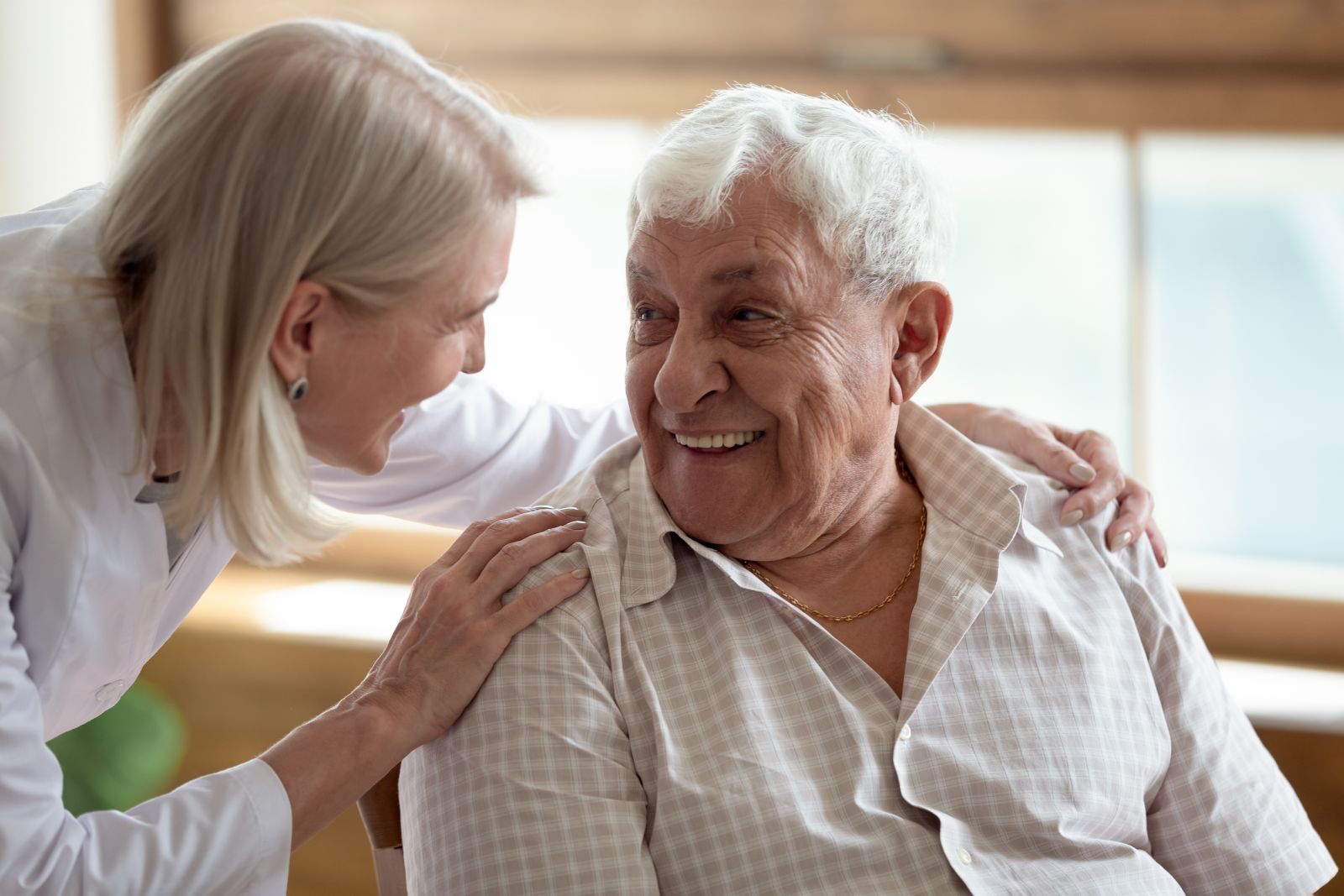 a young woman interacting with an older man