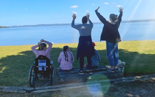 Everyday Ability Workers and a Client enjoying a lakeside view