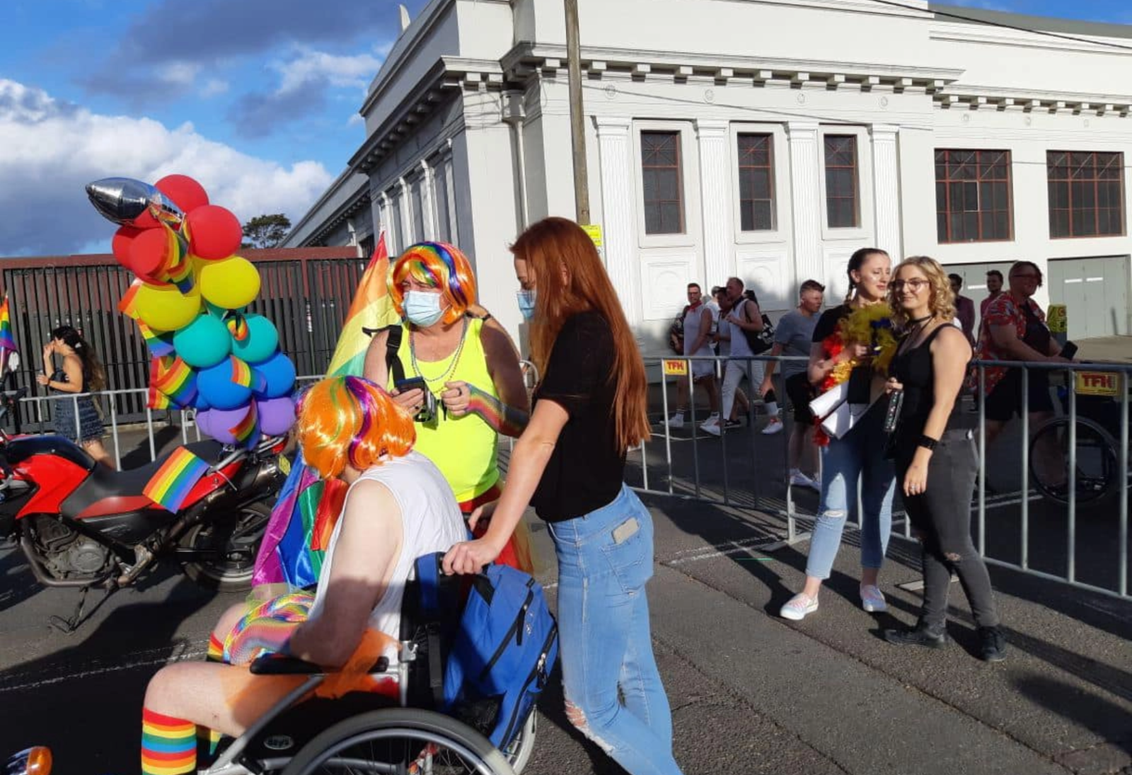 Mardi Gras Parade outside white building