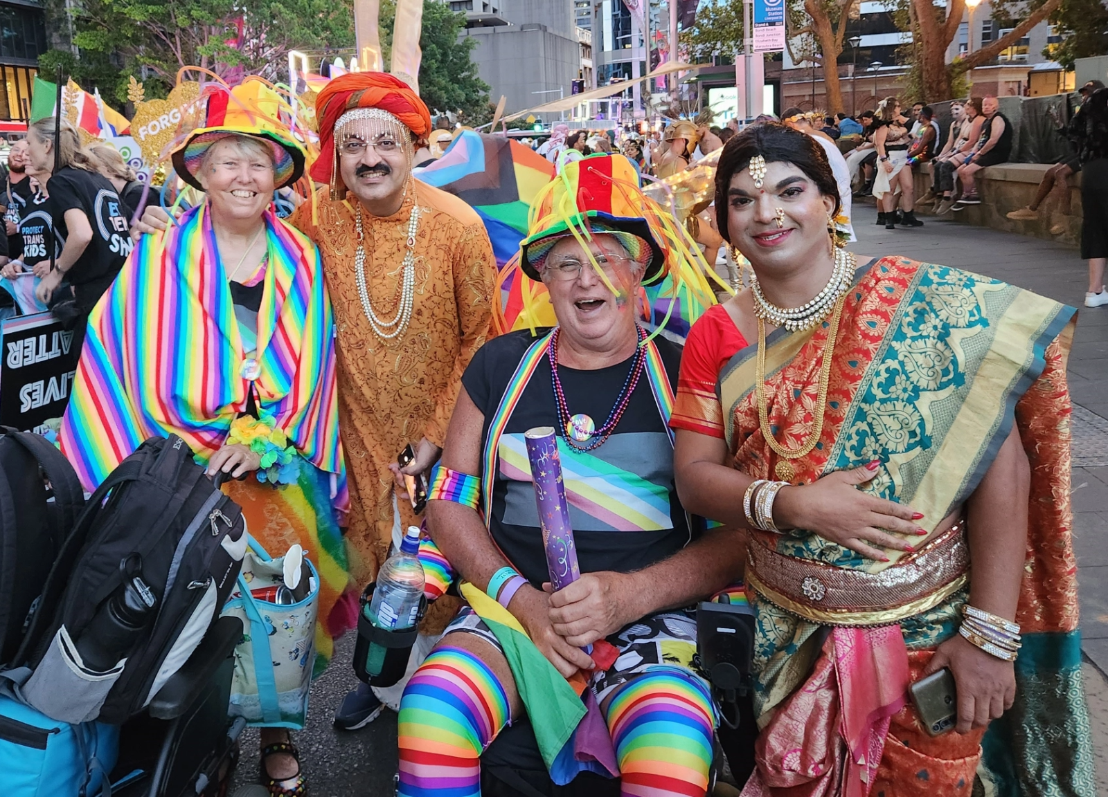 Group of people in colourful clothing at Mardi Gras event