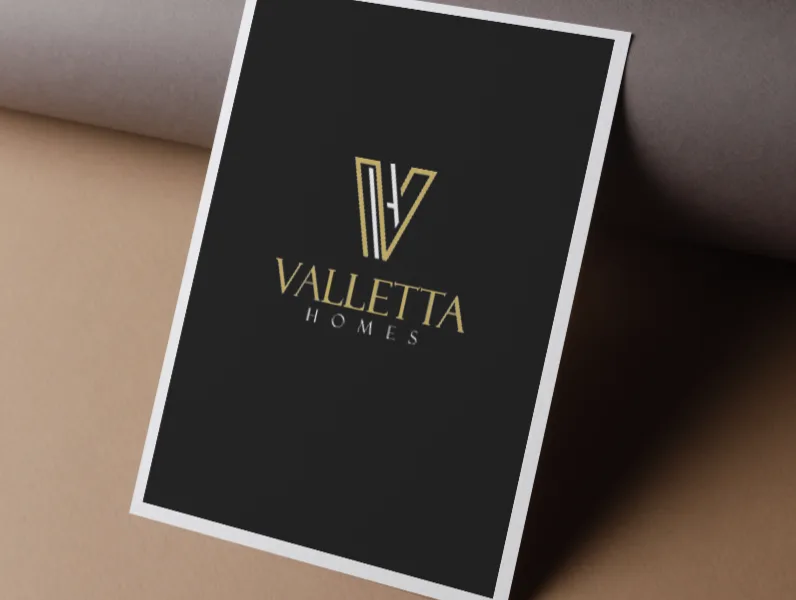 Valletta Homes brochure, logo on black card