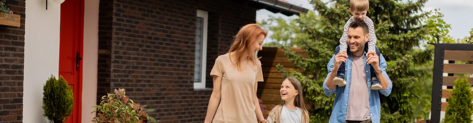 Family with children, brick home