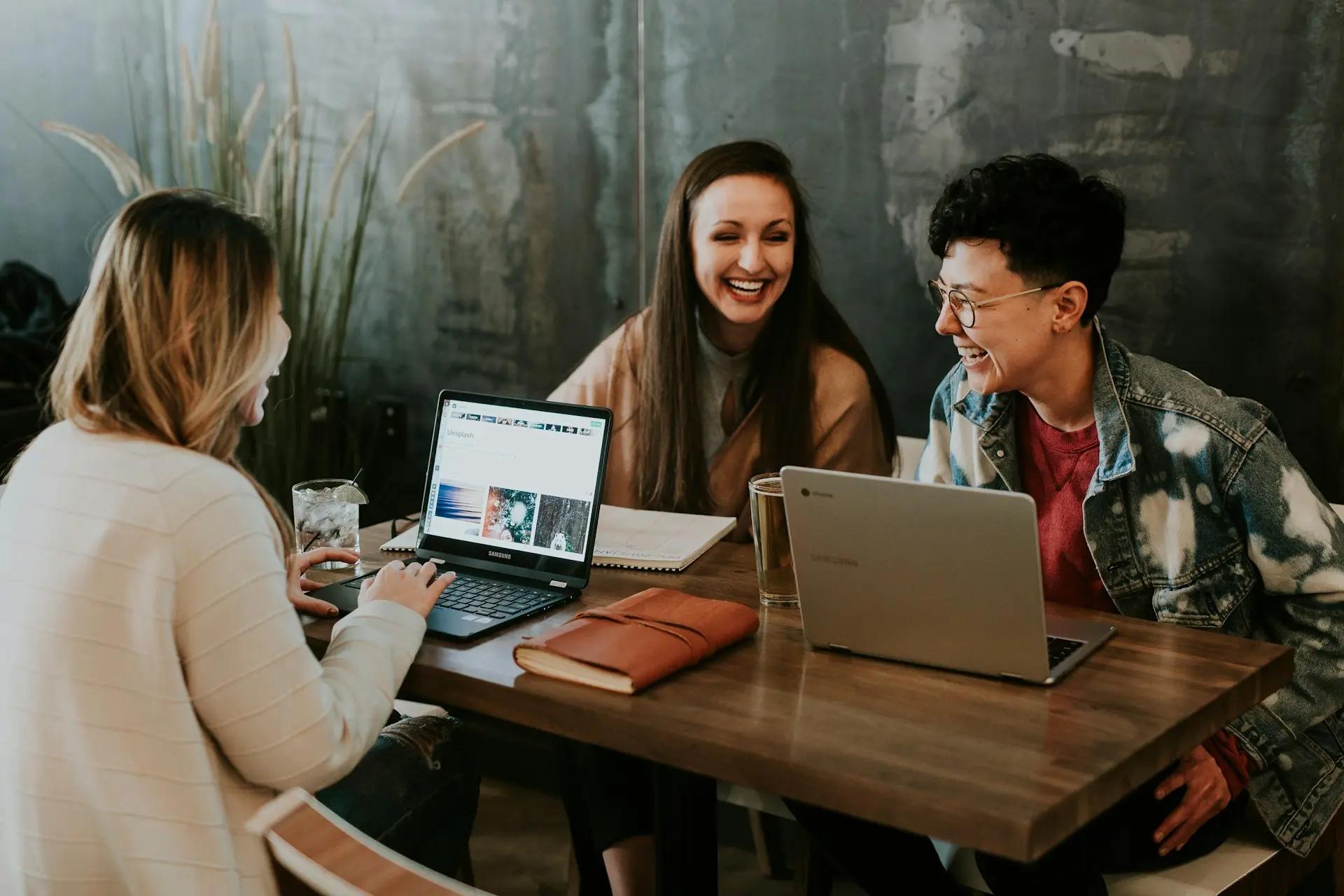 small business owners working and laughing together