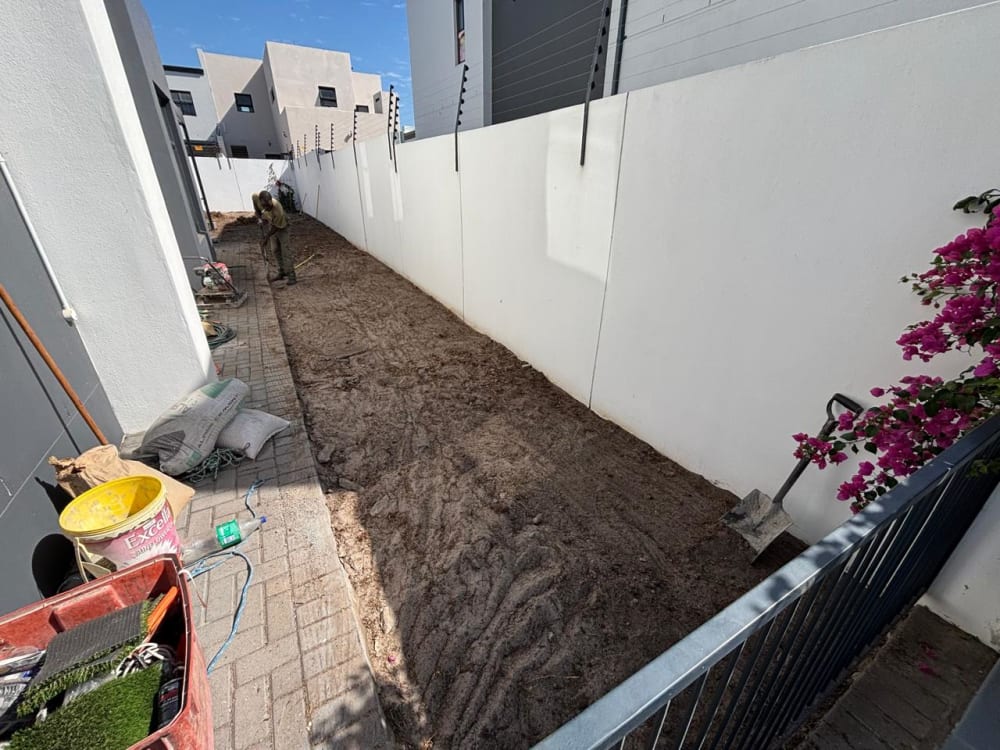 Before - Artificial grass and paving project in Table View