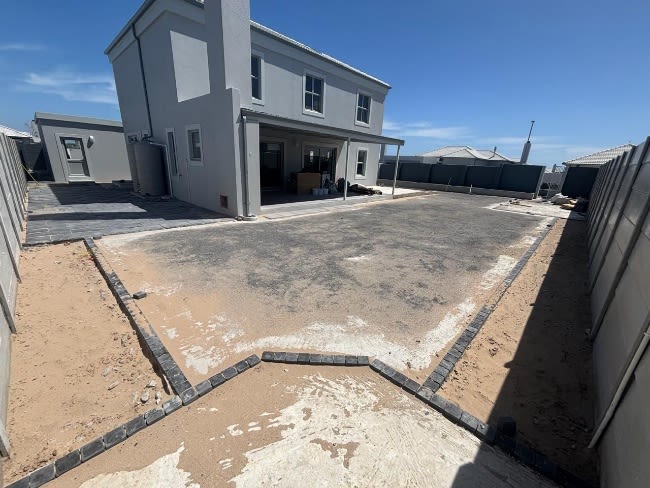 Before - Artificial grass and paving project in Table View