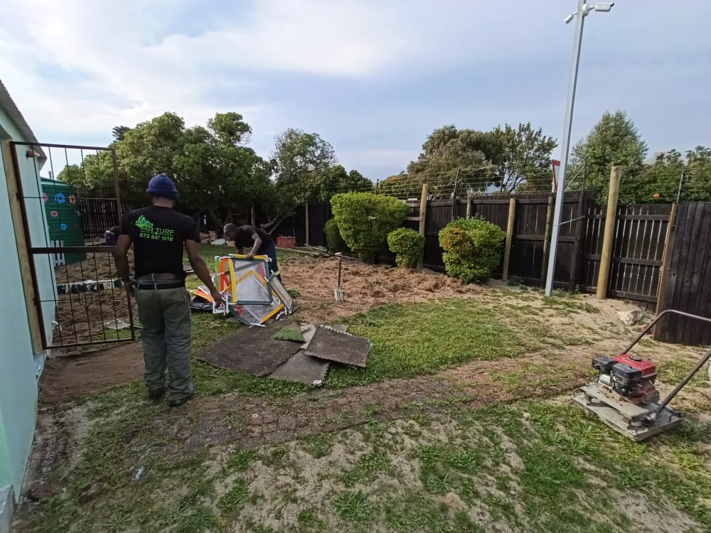 Before - Artificial grass and paving project in Table View