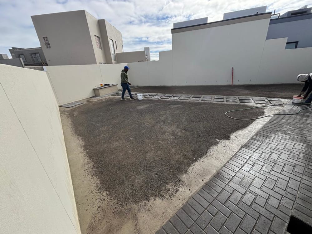 Before - Artificial grass and paving project in Table View