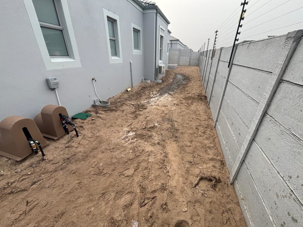 Before - Artificial grass and paving project in Table View