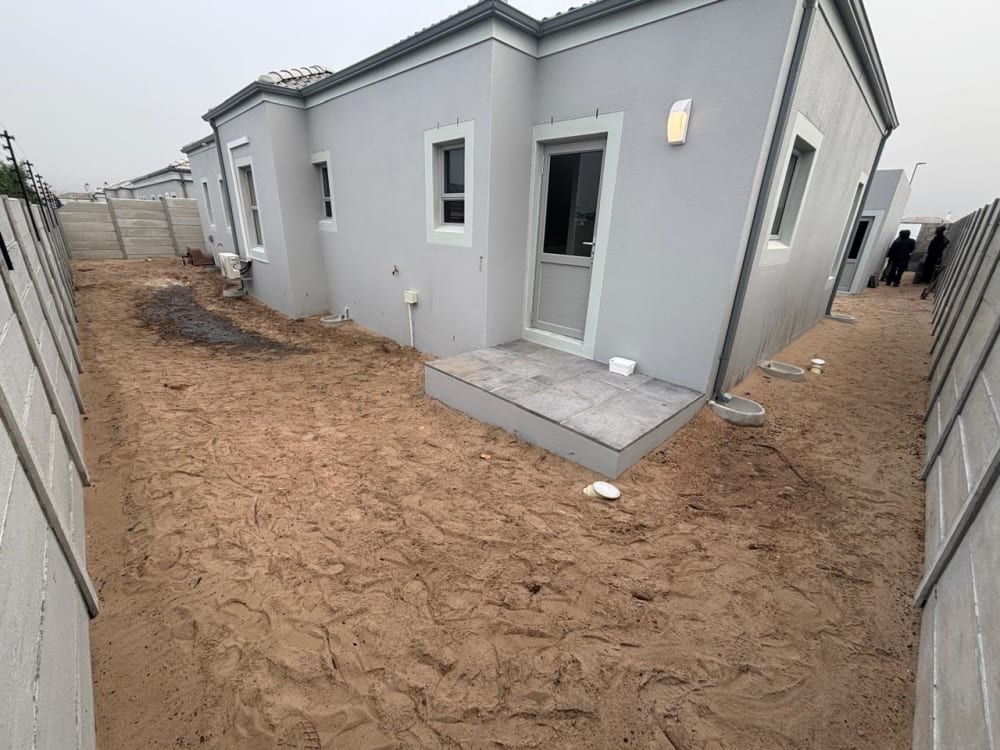 Before - Artificial grass and paving project in Table View
