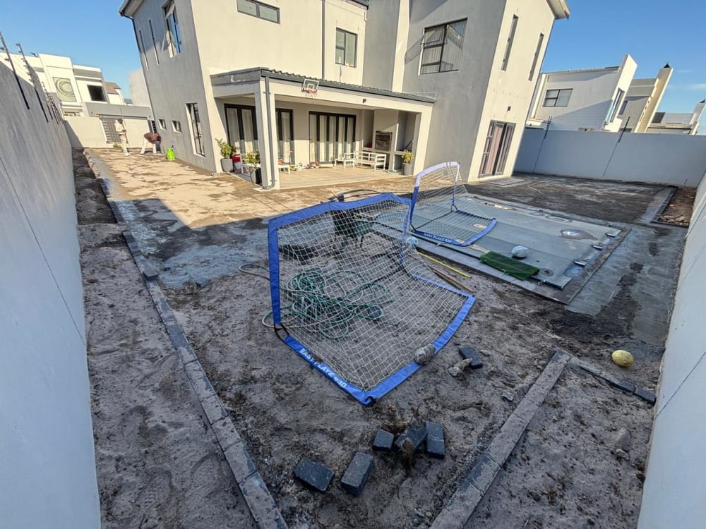 Before - Artificial grass and paving project in Table View