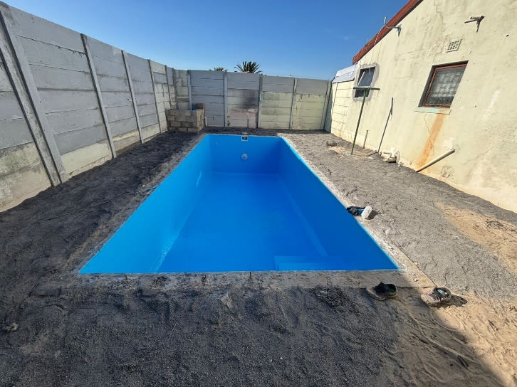 Artificial grass around swimming pool