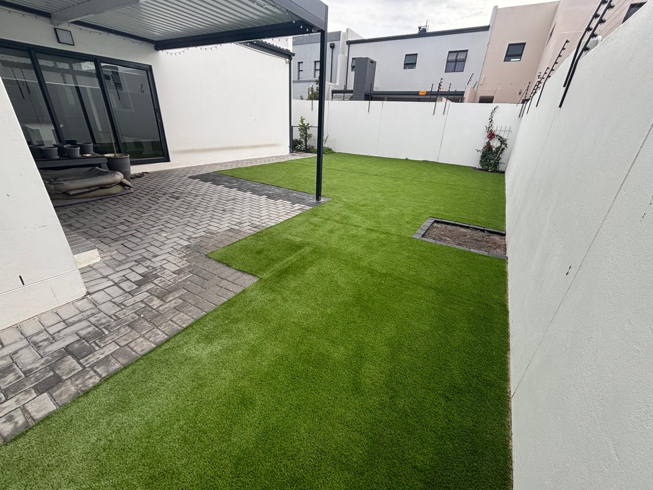 After - Artificial grass and paving project in Table View