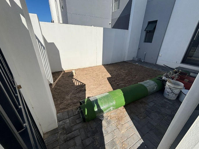 Before - Artificial grass and paving project in Table View