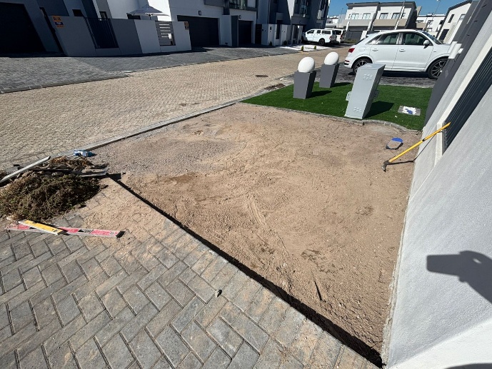 Before - Artificial grass and paving project in Table View