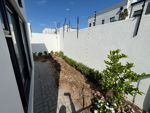 Before - Artificial grass and paving project in Table View
