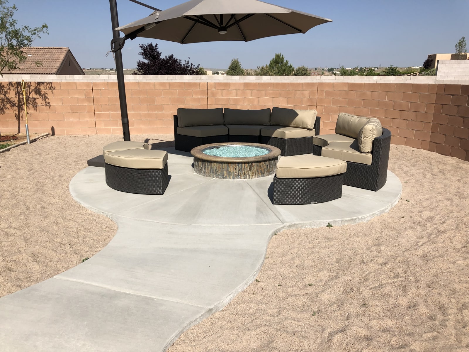 Custom Firepit and Curved Sidewalk