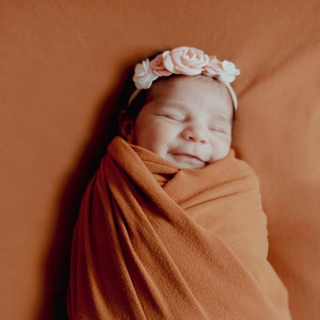 Smiling baby in a wrap