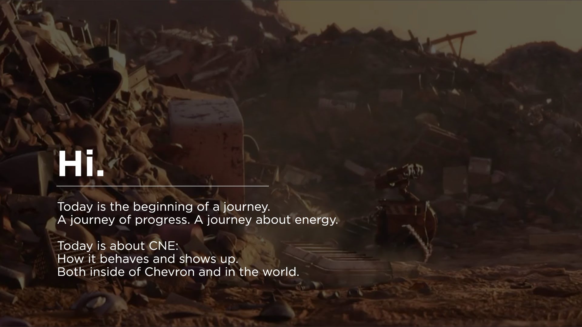 Chevron New Energies, slide reading Hi. Today is the beginning of a journey, over a film still of a small robot among scrap