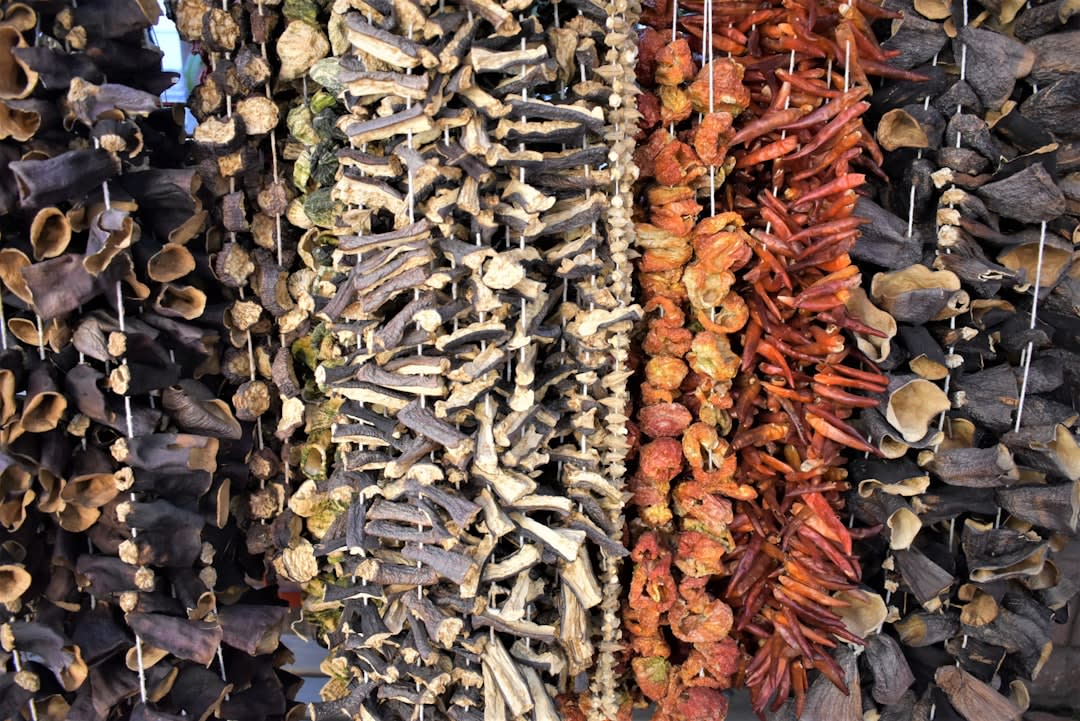 The bustling Tuesday market in Fethiye with stalls of spices, dried fruit, and vegetables under woven awnings