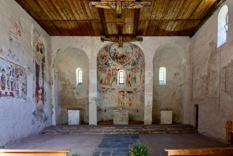 Faded medieval fresco of a ship on stormy painted waves on the vaulted stone ceiling of Kumlinge church