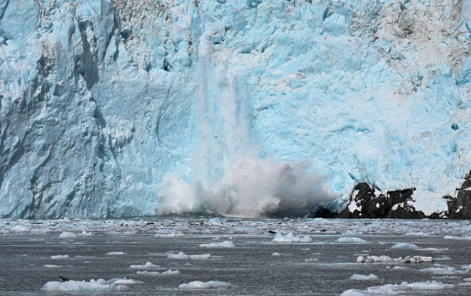 Childs Glacier's blue ice face calving directly into the Copper River near Cordova