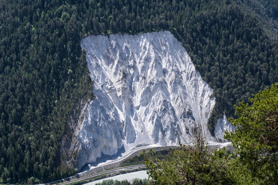 The scarred eastern face of Turtle Mountain where the 1903 slide broke away, the missing section of peak clearly visible against the sky
