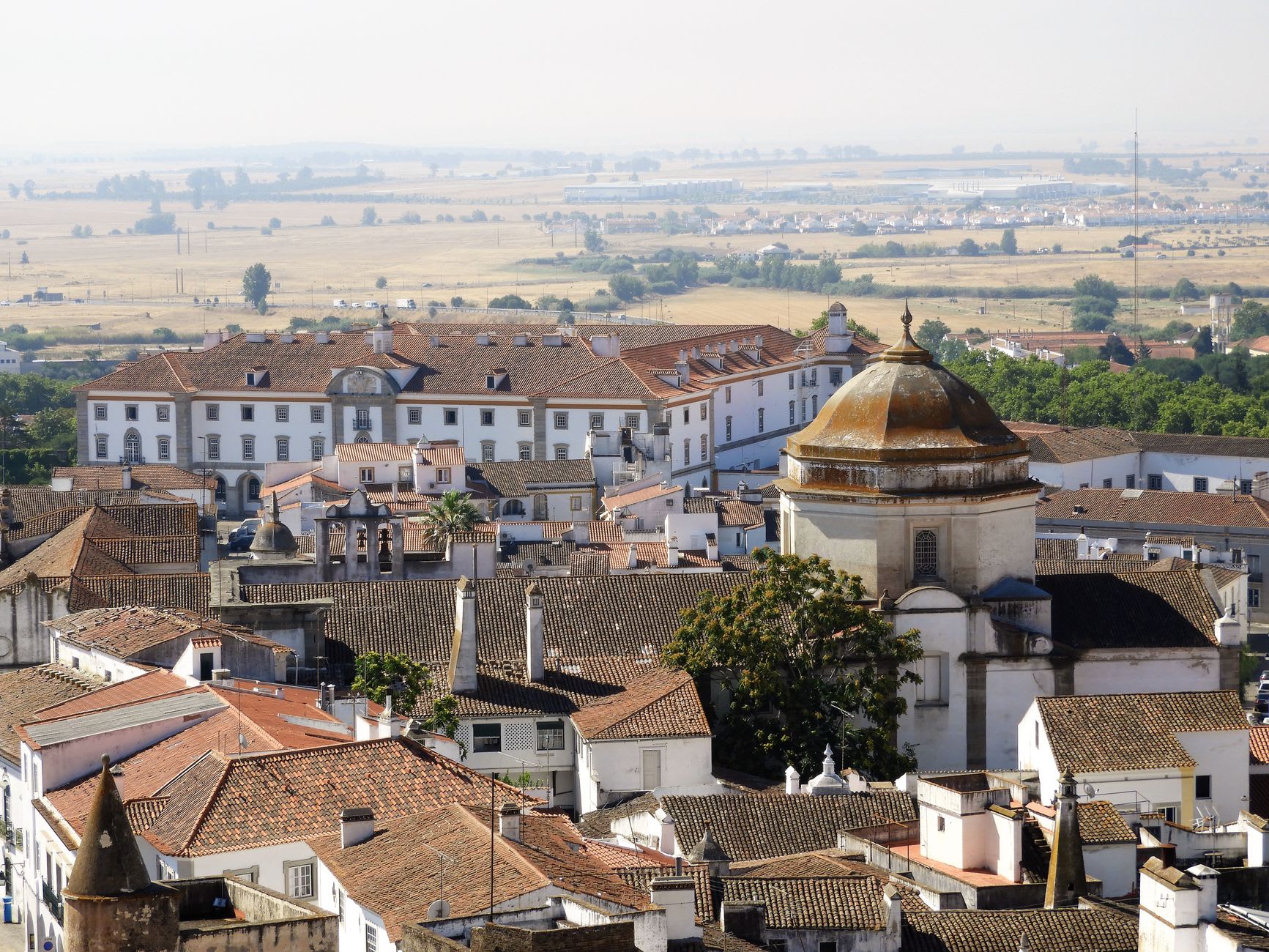 The Guadiana river below Mértola seen from the castle walls, dark water between reddish-brown hillsides