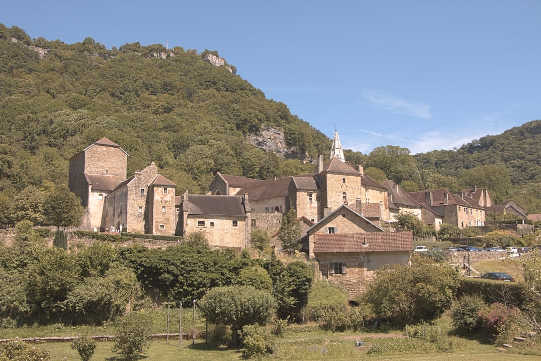 Grassy ramparts and moat encircling Neuf-Brisach's fortified walls