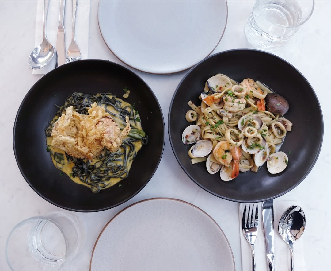 A plate of 'ndunderi ricotta gnocchi with tomato sauce at a seafront restaurant in Minori