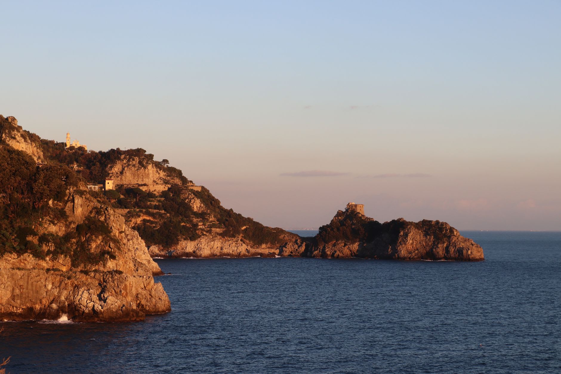 The Marina di Praia hidden beach at Praiano, enclosed in its narrow sea gorge with turquoise water and a single beach bar