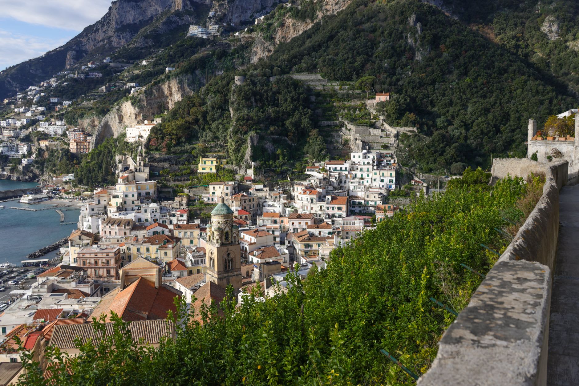 The paper mill ruins in Valle delle Ferriere with roofless stone walls, lemon trees growing through the structure, and the stream running alongside