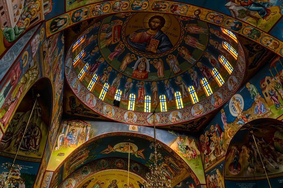 The interior of a former Greek Orthodox church in Mustafapaşa with faded frescoes still visible on the stone walls
